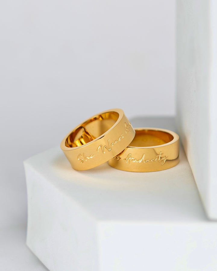 “She wears audacity” ring