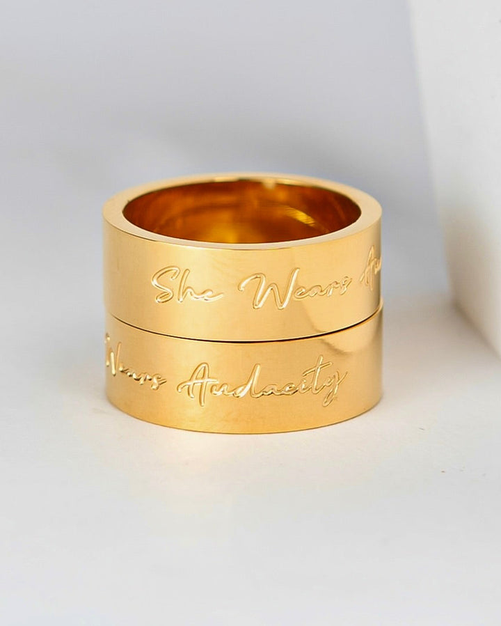 “She wears audacity” ring